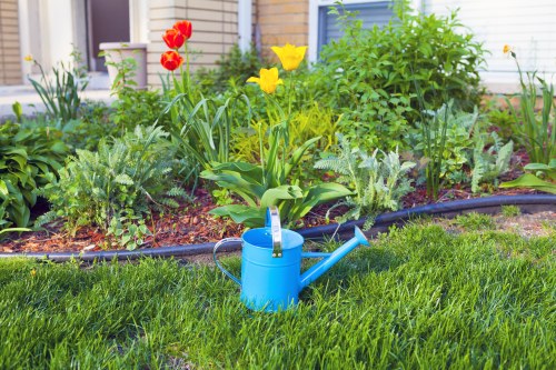 Gardener preparing lawn equipment at Coney Hall property entrance